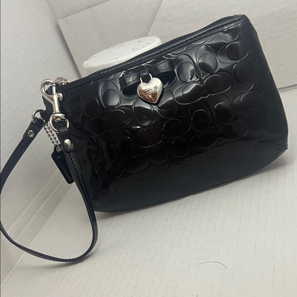 Coach Handbags - Coach Black Embossed Wristlet with Heart Charm